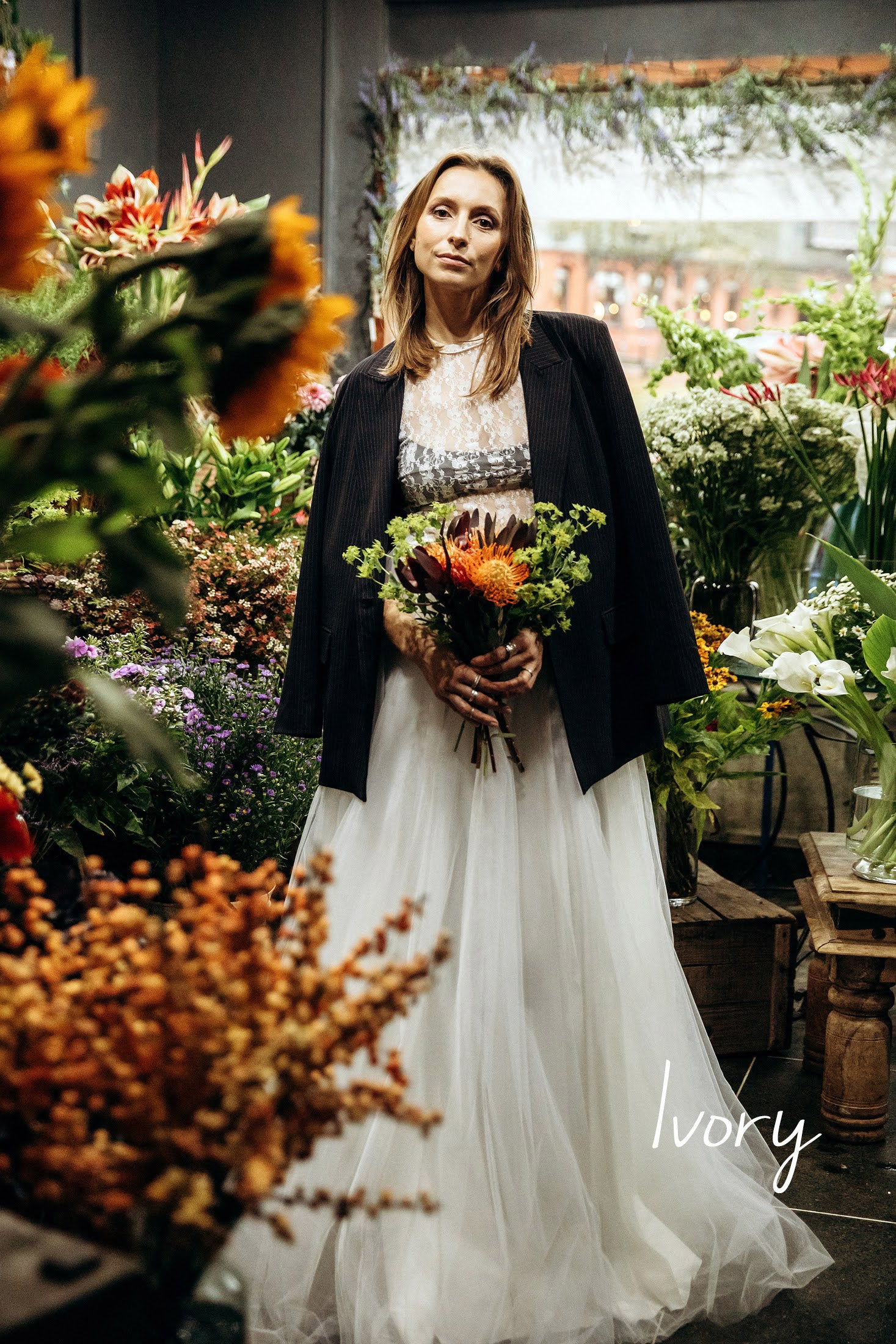 Ivory maxi tulle skirt paired with a formal blazer, reworn after wedding