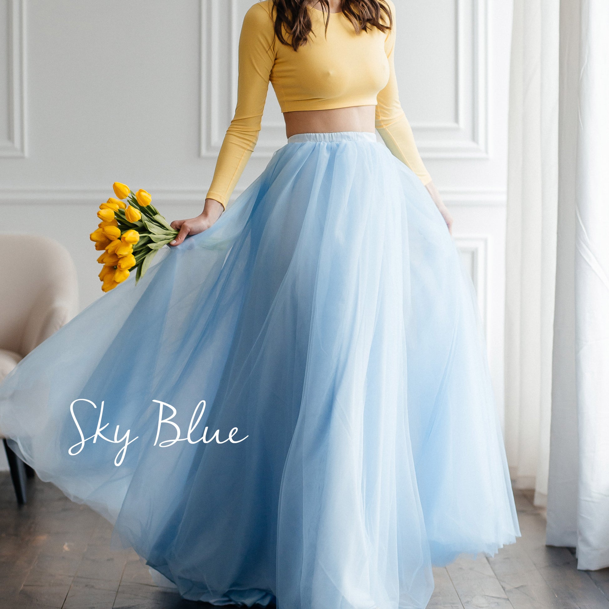 Sky blue tulle skirt styled for a prom look · playful wedding outfit