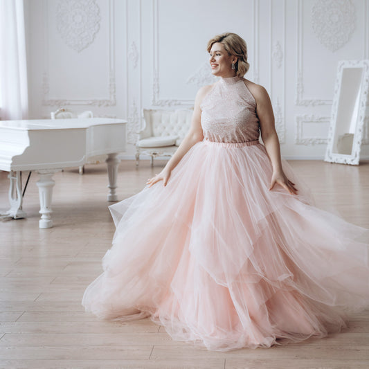 Custom blush pink maxi tulle wedding skirt on a plus size bride.