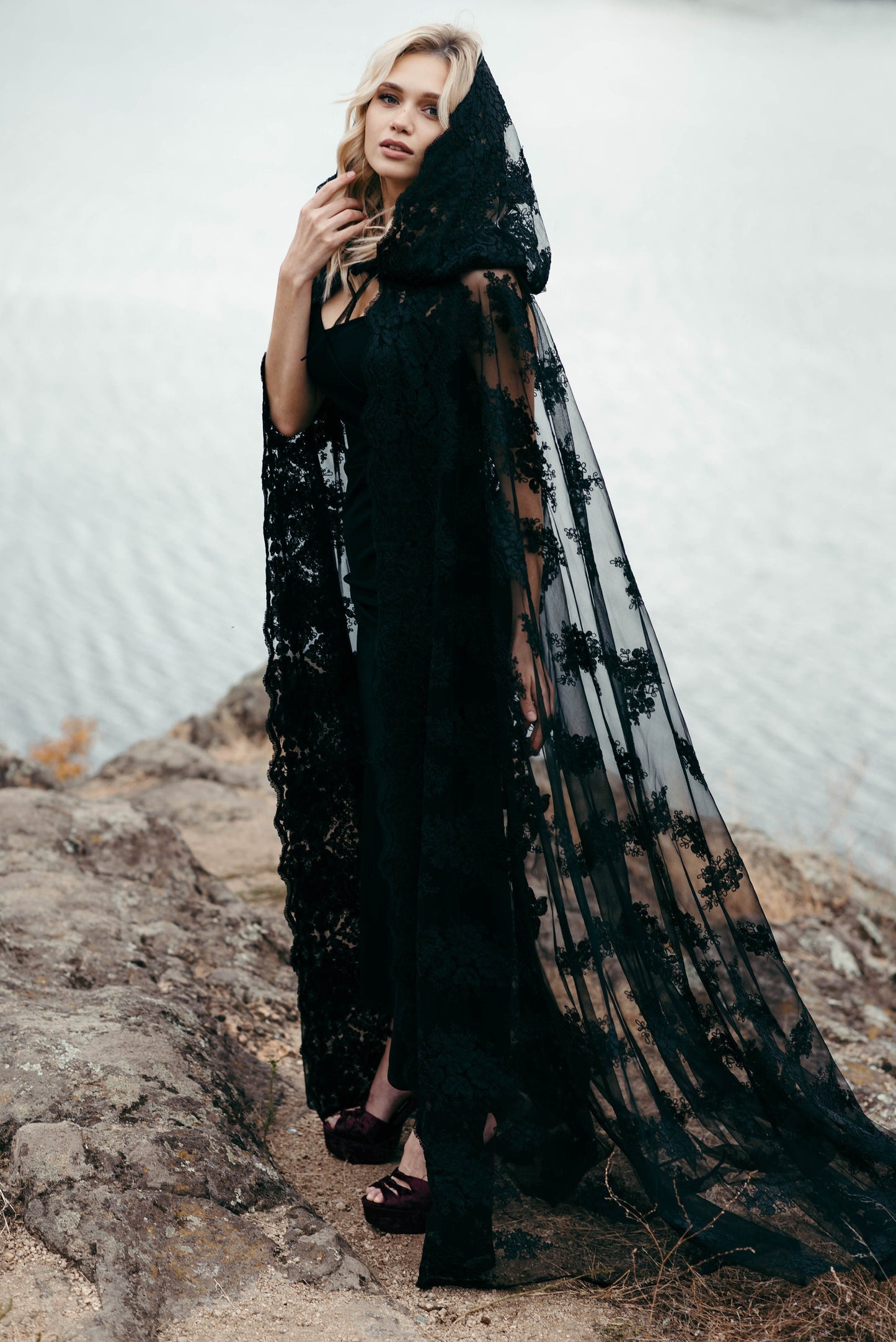 Gothic black lace bridal veil with hood styled for outdoor ceremony