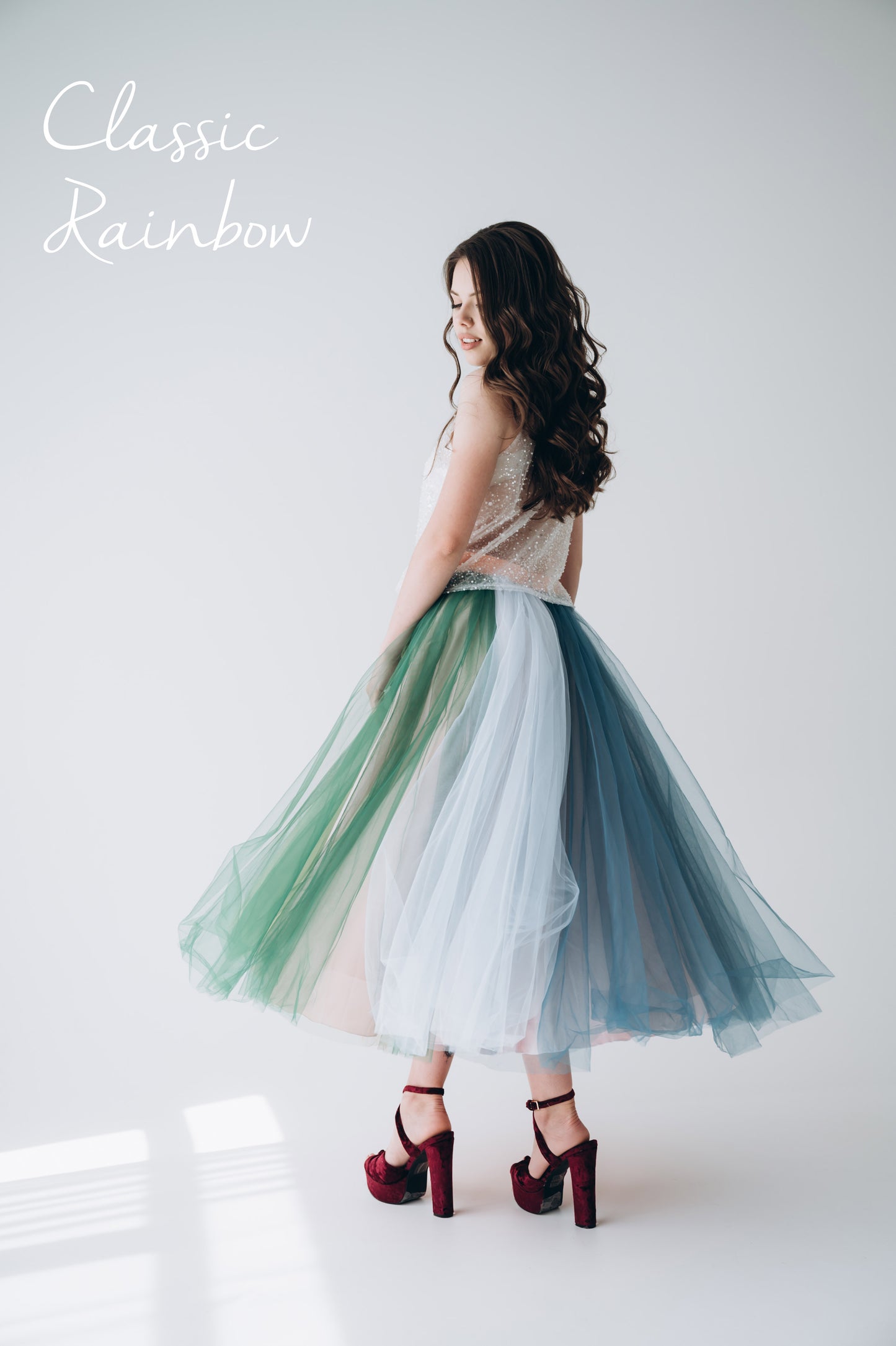 Model in rainbow tulle tea length skirt styled for Pride celebration · fun special occasion look for LGBT events