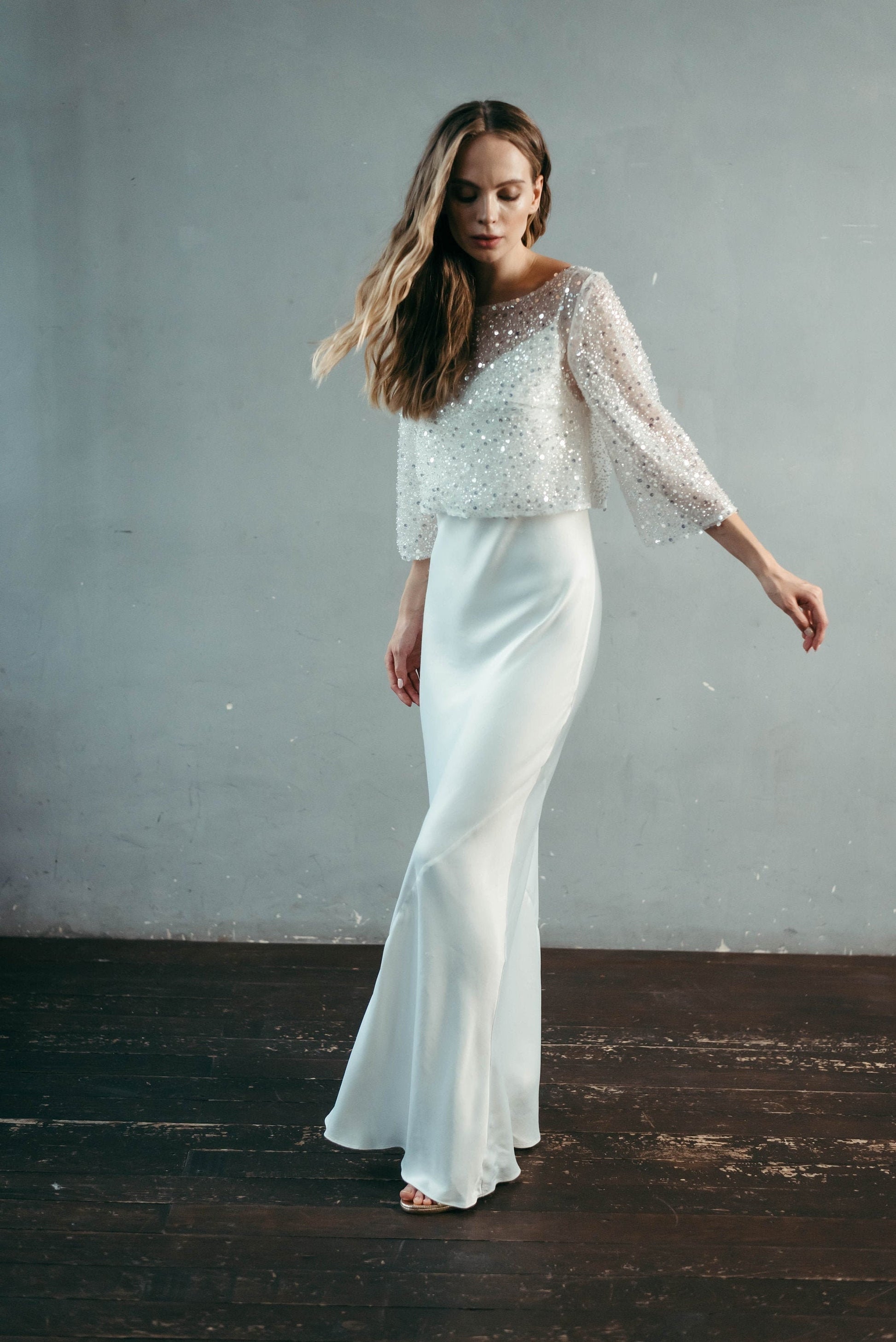 Elopement bride wearing beaded ¾ sleeve bridal topper over satin dress – inclusive bridal separates for all sizes.