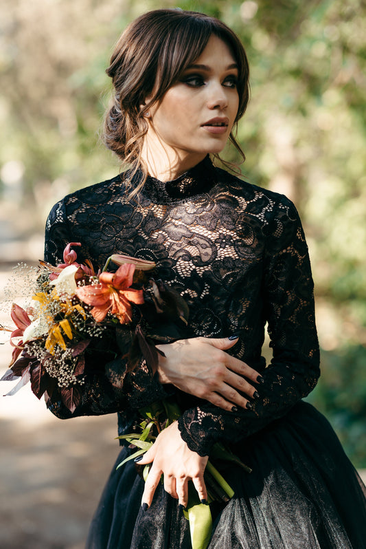 Autumn bridal look with black lace top and grey tulle skirt, styled with bouquet and soft waves