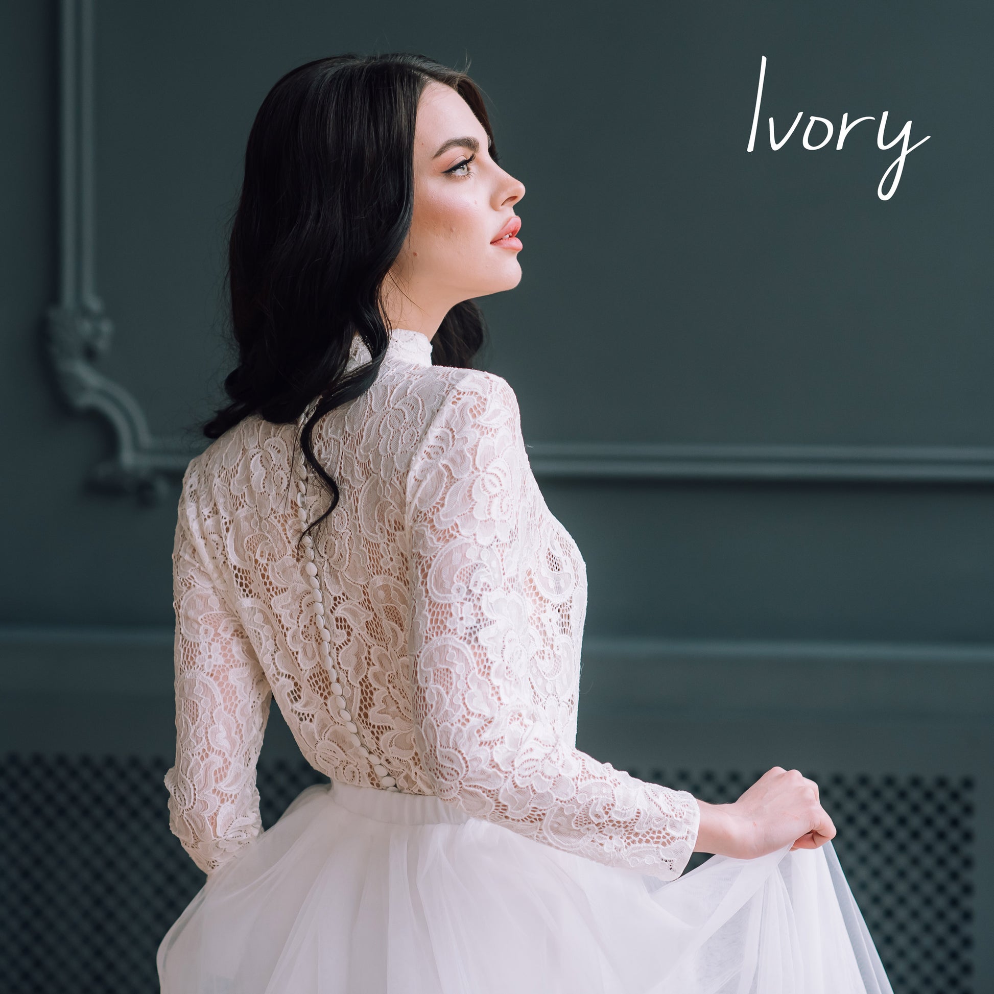 UK Bride is wearing a long sleeved lace bridal top and a bespoke maxi long ivory tulle skirt.