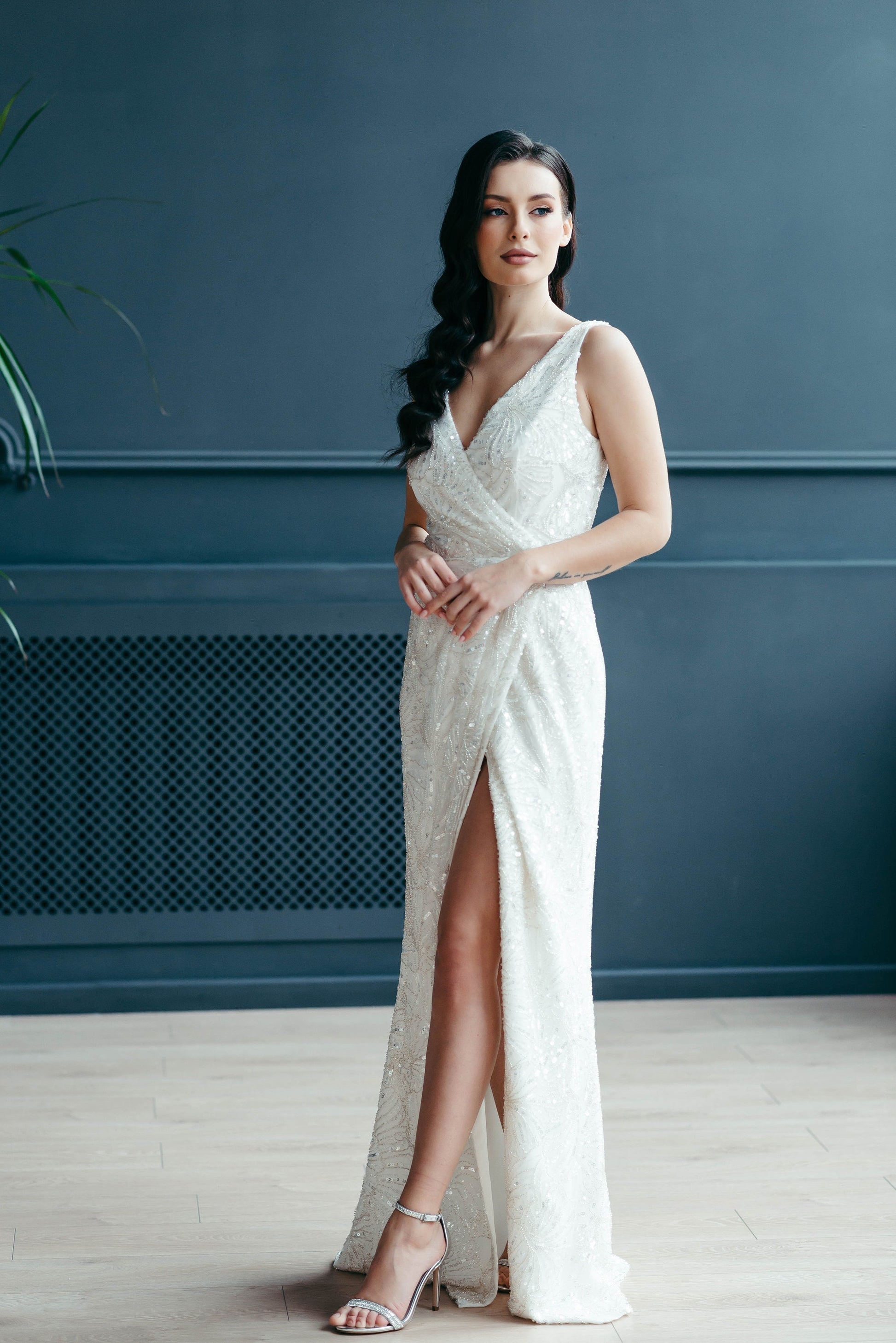 Bride in ivory embellished lace wedding gown with side slit, minimal bridal look for modern weddings and elopements.