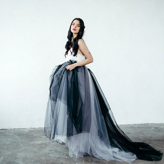 Bride wearing black and grey ombré tulle skirt with train for alternative wedding or black tie event.