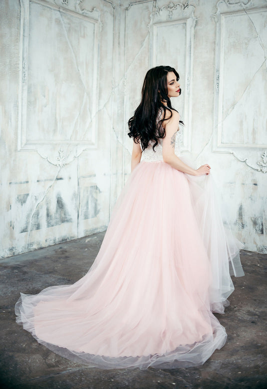 Blush ombré layered tulle bridal skirt styled with lace top for romantic wedding look.
