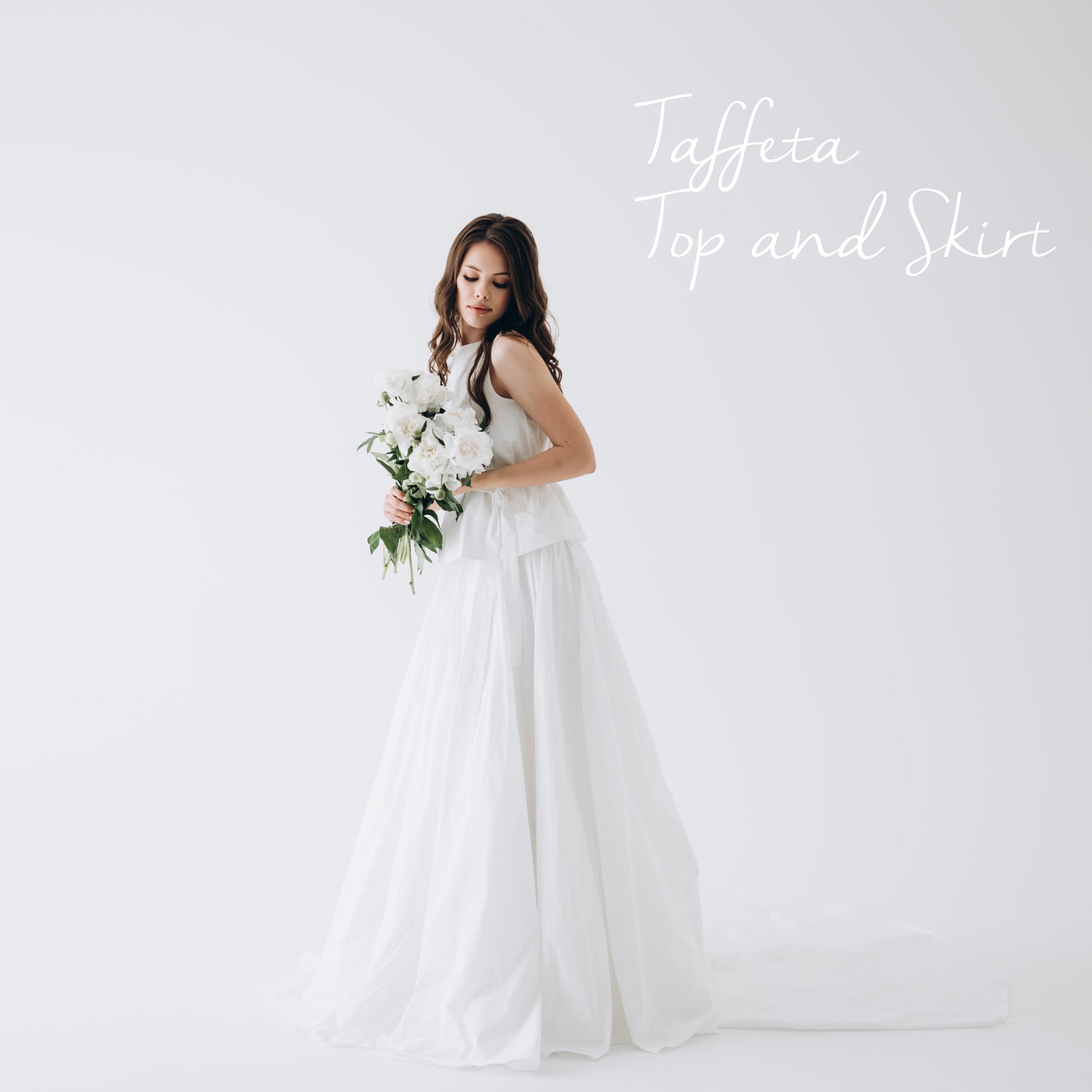 Detail view: wide waistband and lightweight shape of white bridal skirt