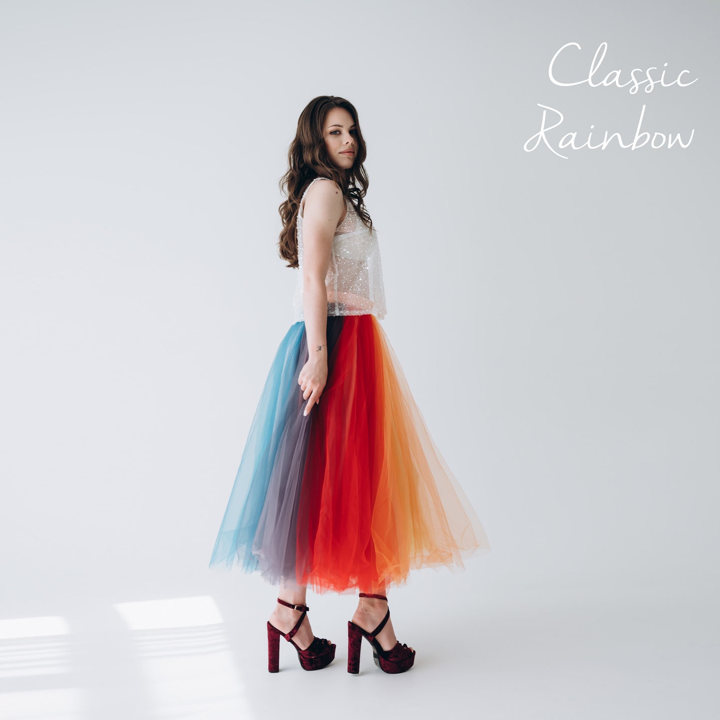 Classic rainbow midi skirt outfit · young model at LGBT wedding as guest or Pride festival party look