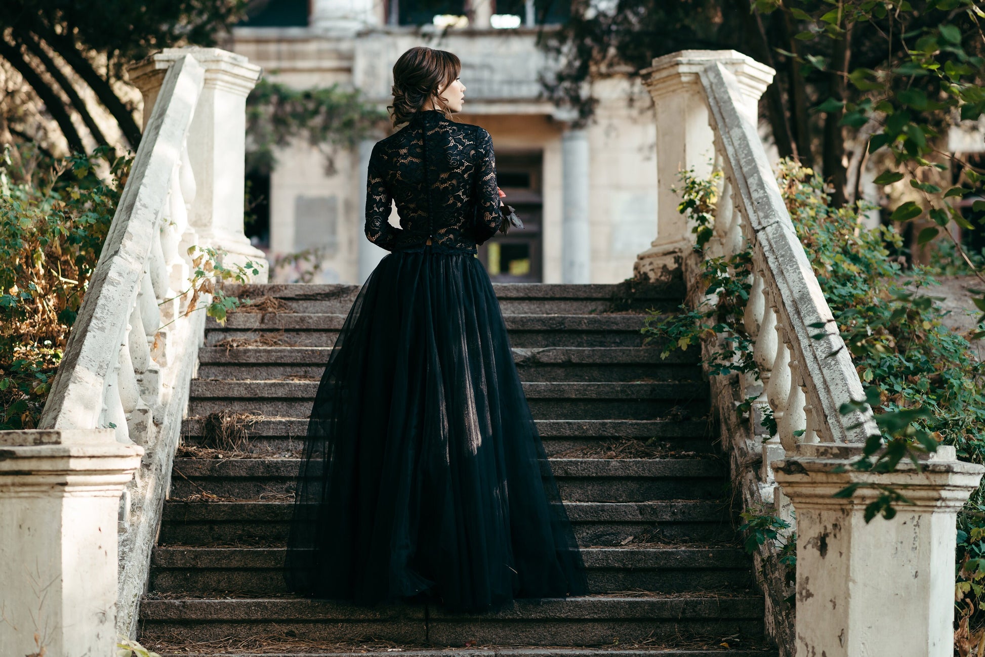 Full length shot of intricate black lace fabric showing floral pattern and expert craftsmanship, part of a handmade bridal separate set.