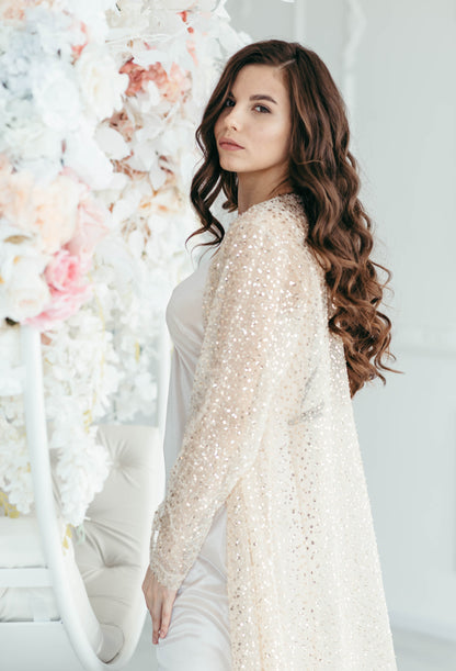 Iona bridal cape, floral backdrop, full length front view