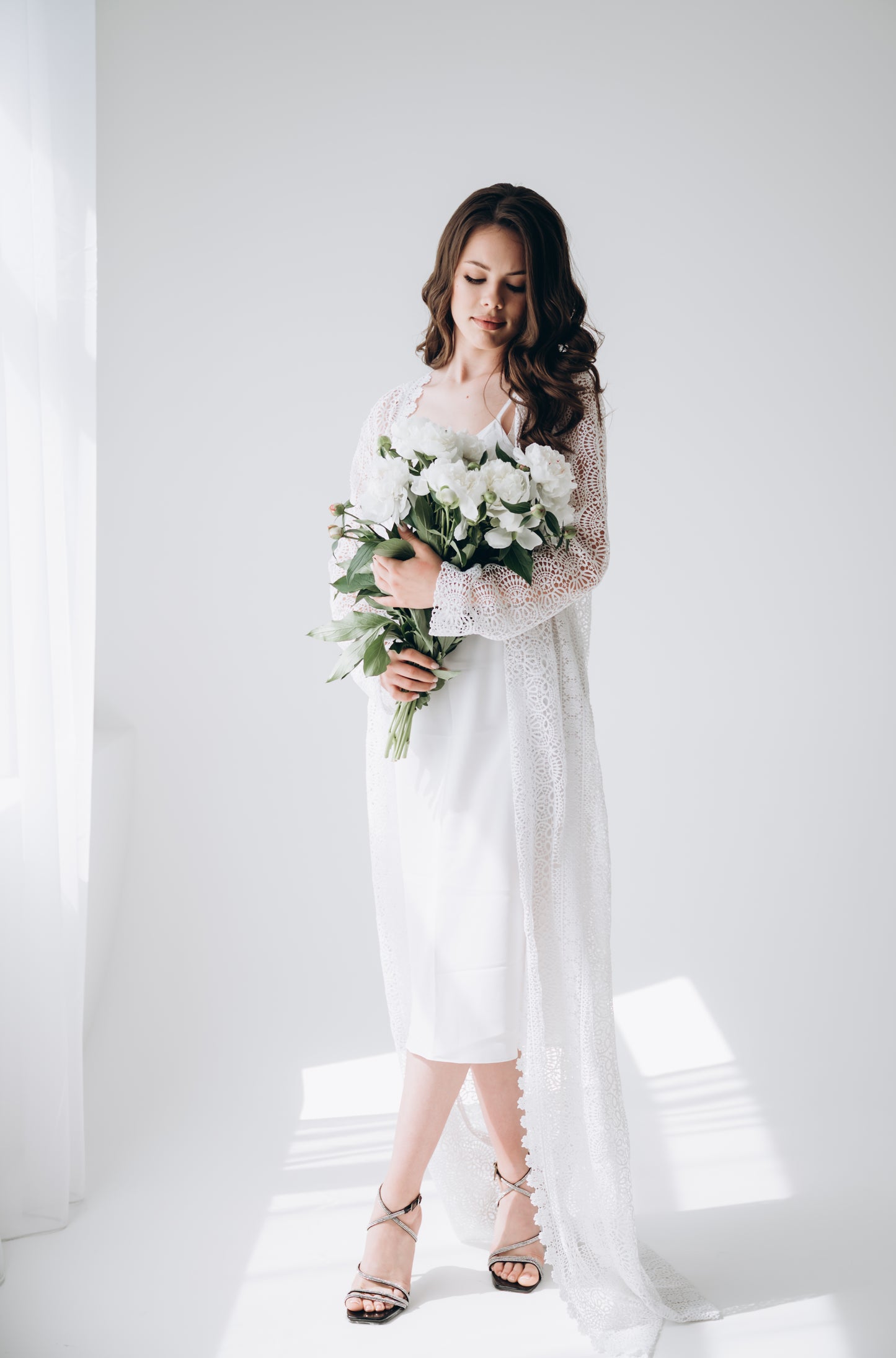 Bride wearing white wedding dress, side profile
