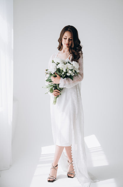 Bride wearing white wedding dress, side profile