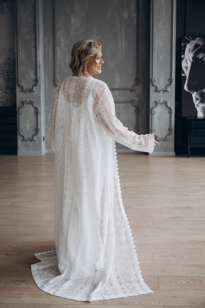 Bride holding bouquet, wearing white wedding dress