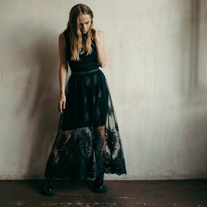 Front view of black lace overskirt showing its sheer flowing design, a stunning option for elopements or photoshoots.