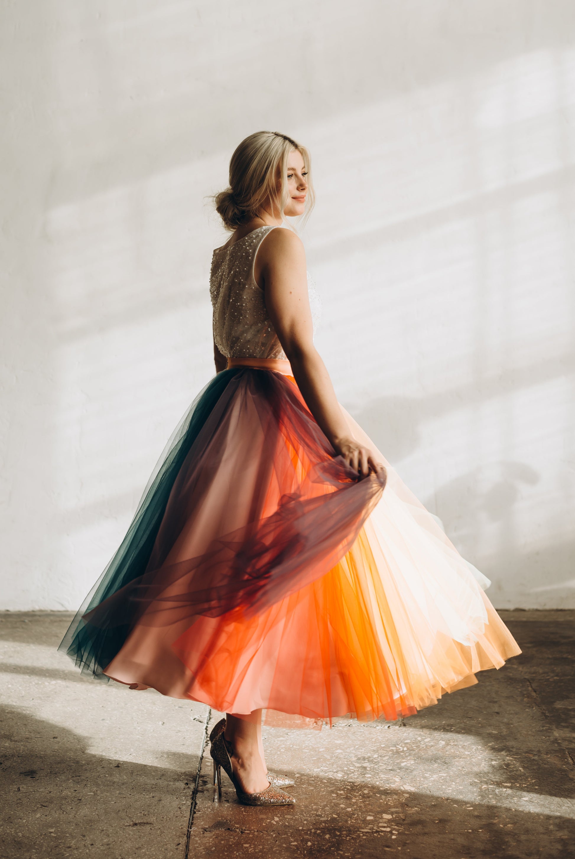 Bride in a colorful rainbow weddong separates