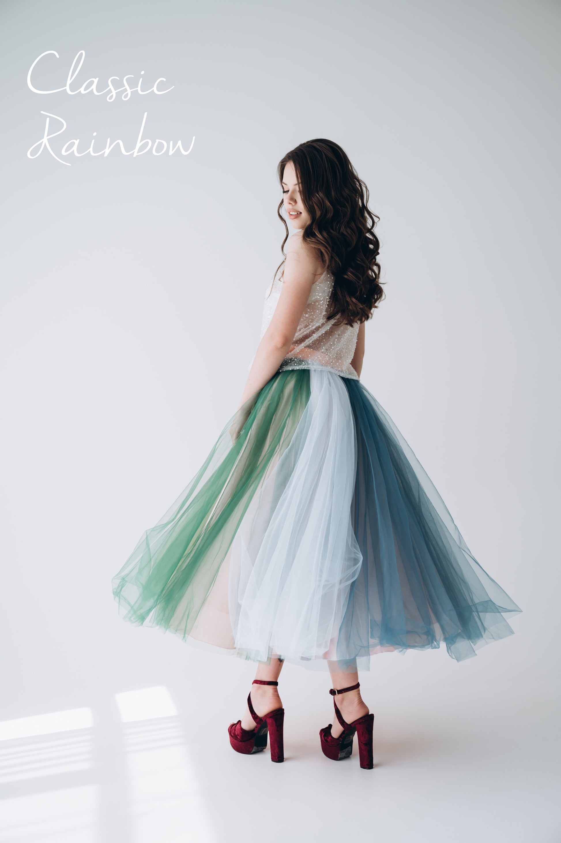 Model in rainbow tulle tea length skirt styled for Pride celebration · fun special occasion look for LGBT events