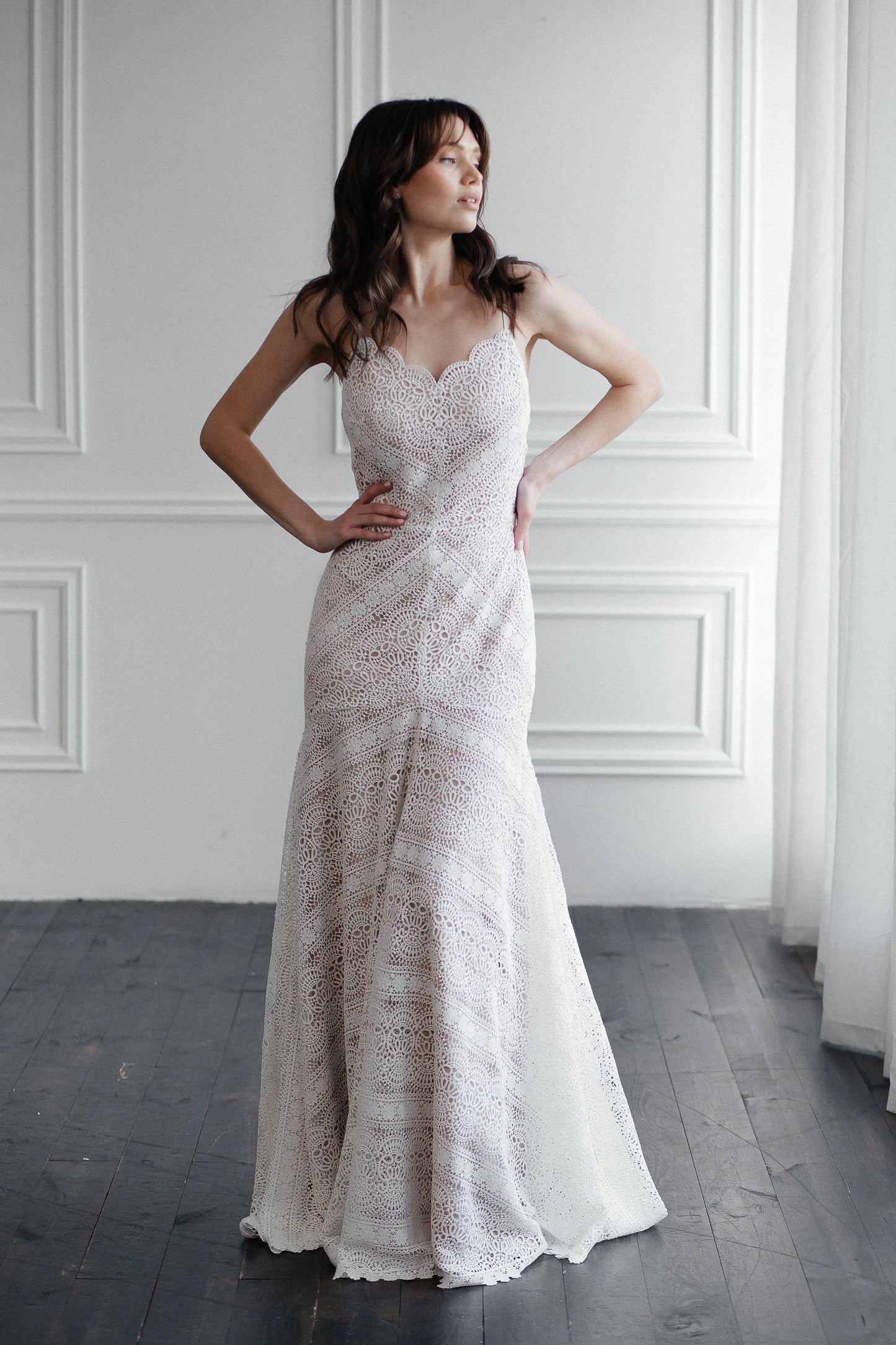 Front view of Liv ivory mer macramé lace wedding dress with fitted mermaid silhouette