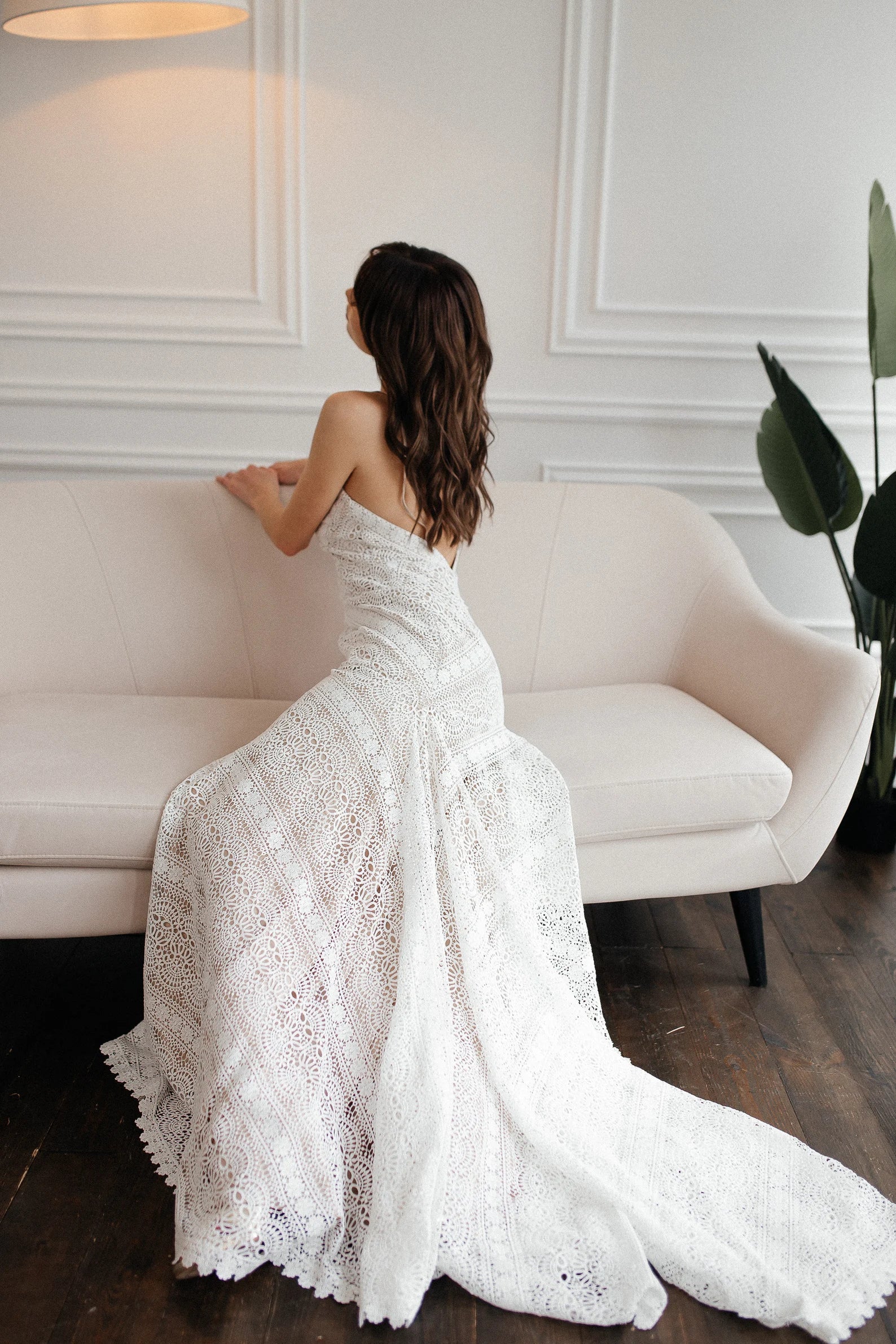 Liv ivory macramé lace wedding dress with long train photographed indoors