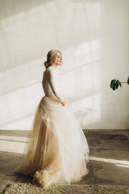 Ivory and cream ombré tulle bridal skirt styled with long sleeve lace blouse