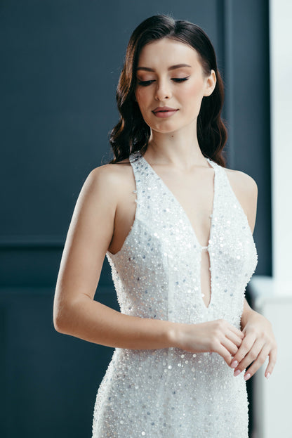 Fitted ivory sequin wedding dress close-up