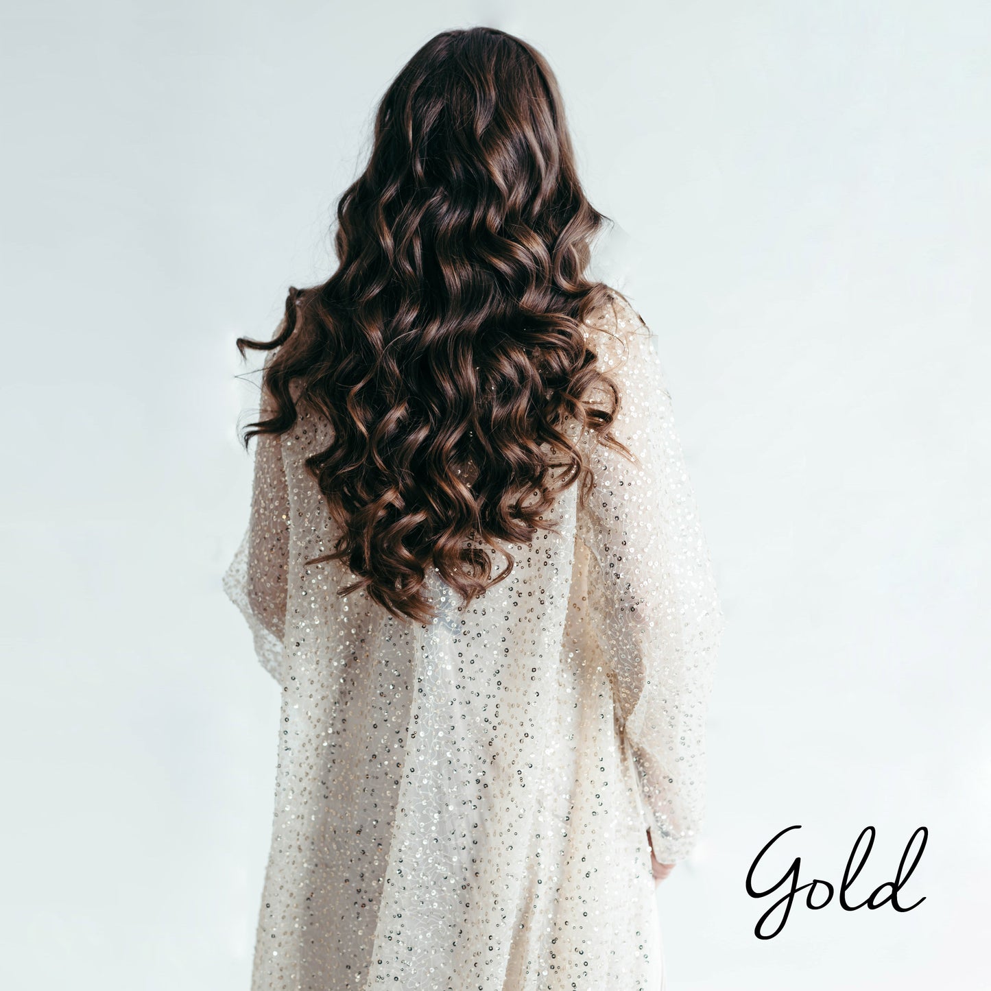 Iona sequin kimono cape, back view, curly hair, studio