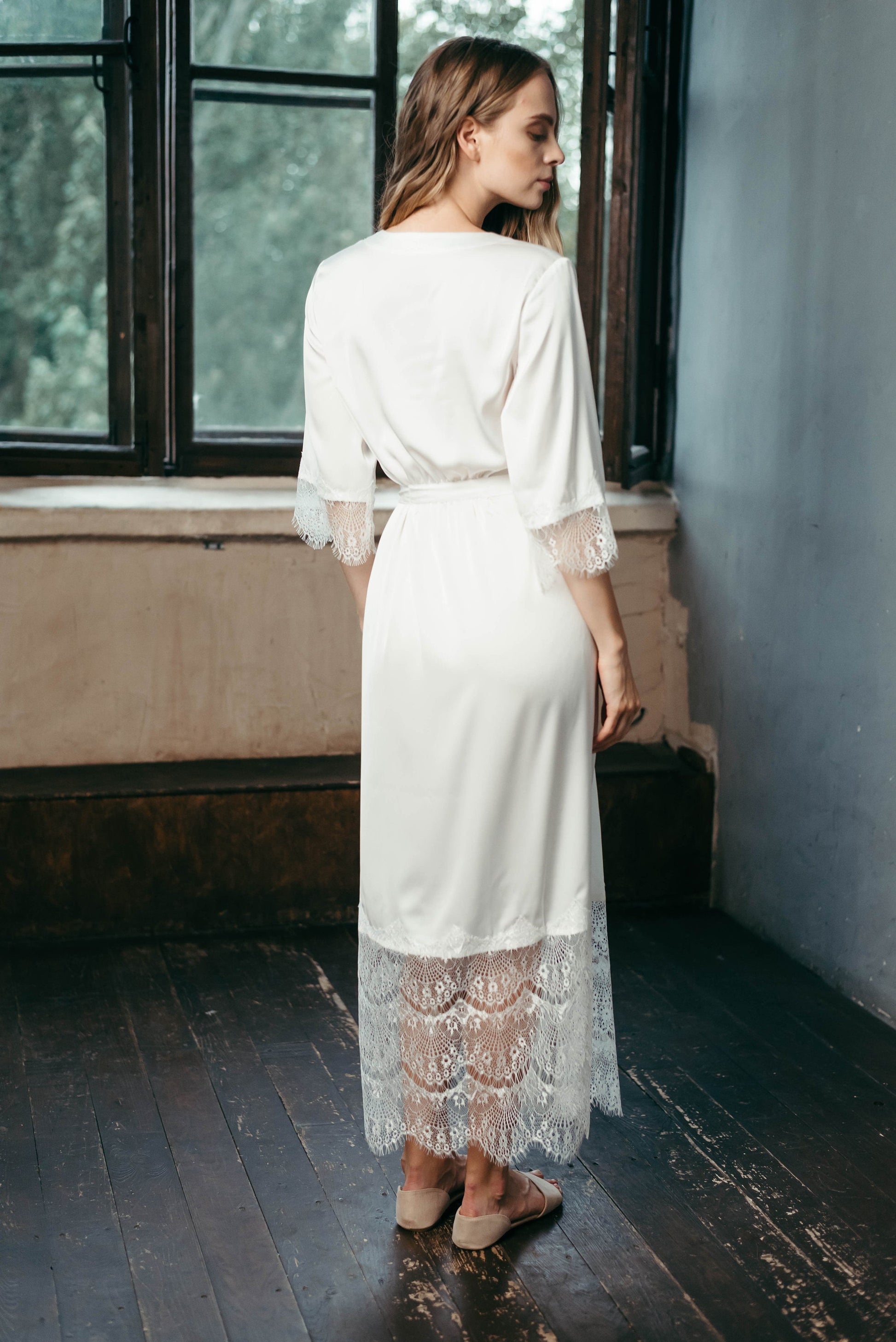 Long lace bridal robe styled for wedding morning photos