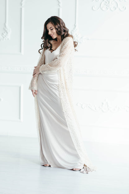 Iona sequin bridal cape, three-quarter view, studio