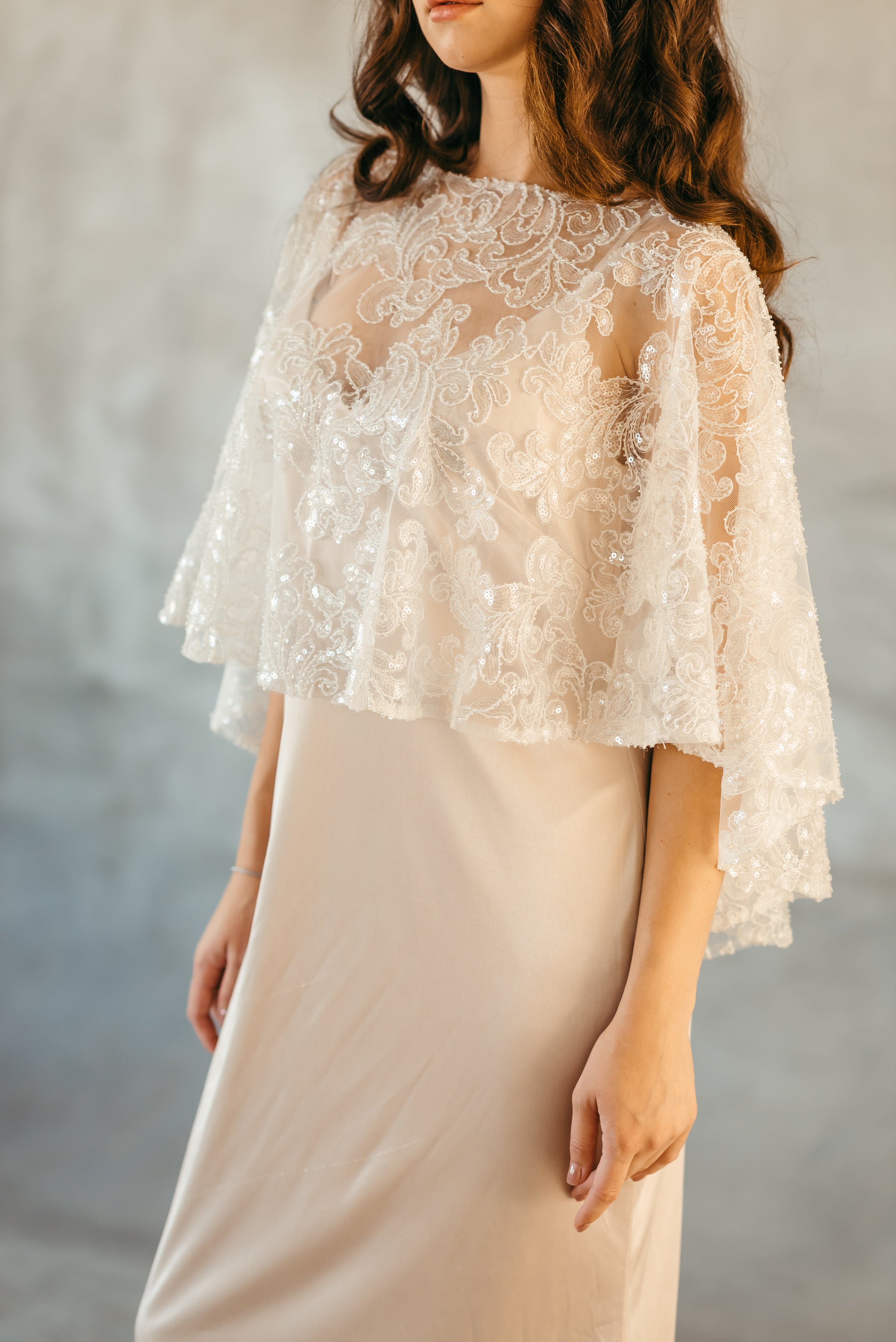 Beaded sequined capelet styled over satin slip dress