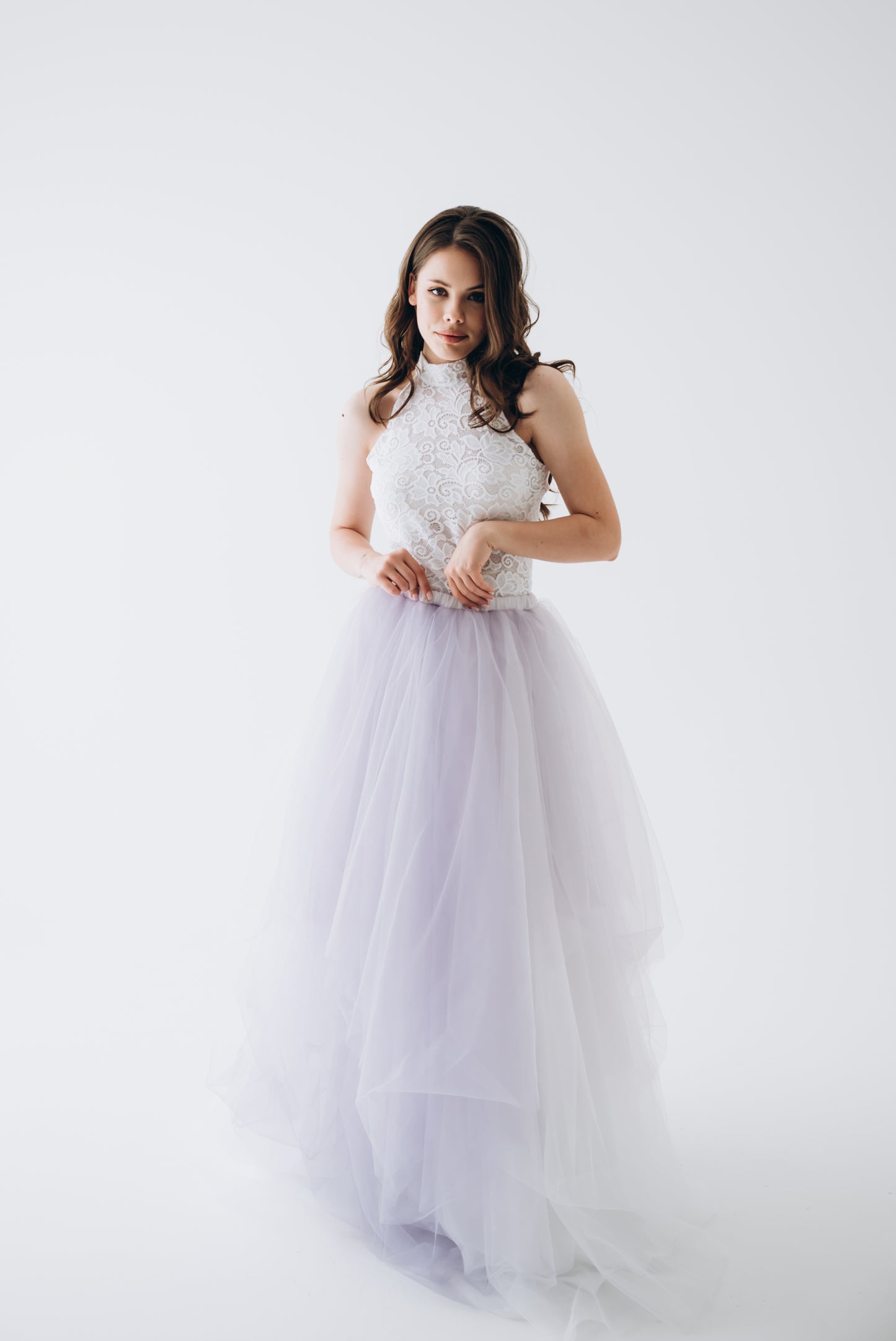 Bride wearing ivory lace bridal top with lavender tulle skirt