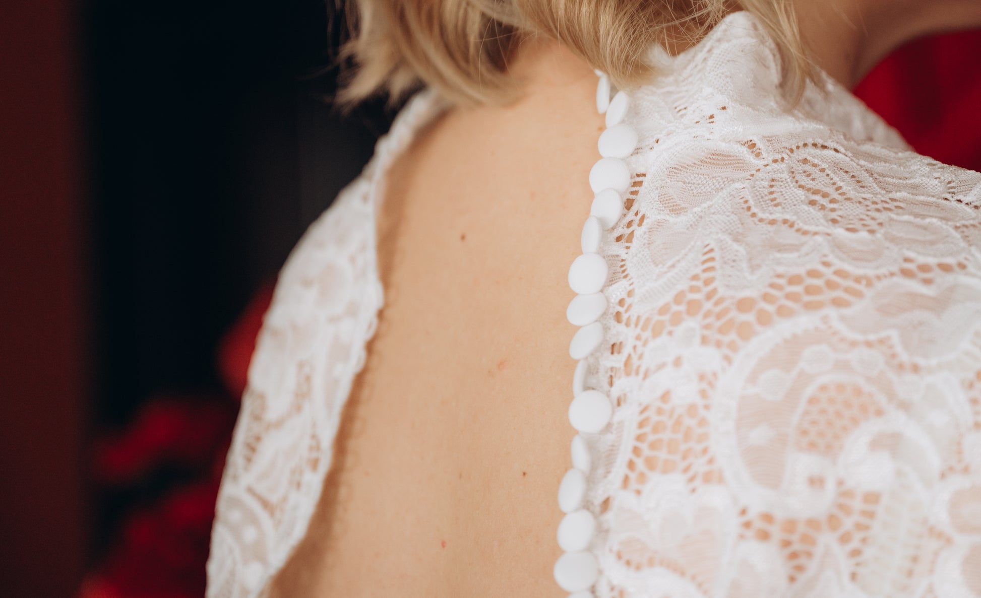 Bride wearing black lace bridal top with bouquet, gothic styling